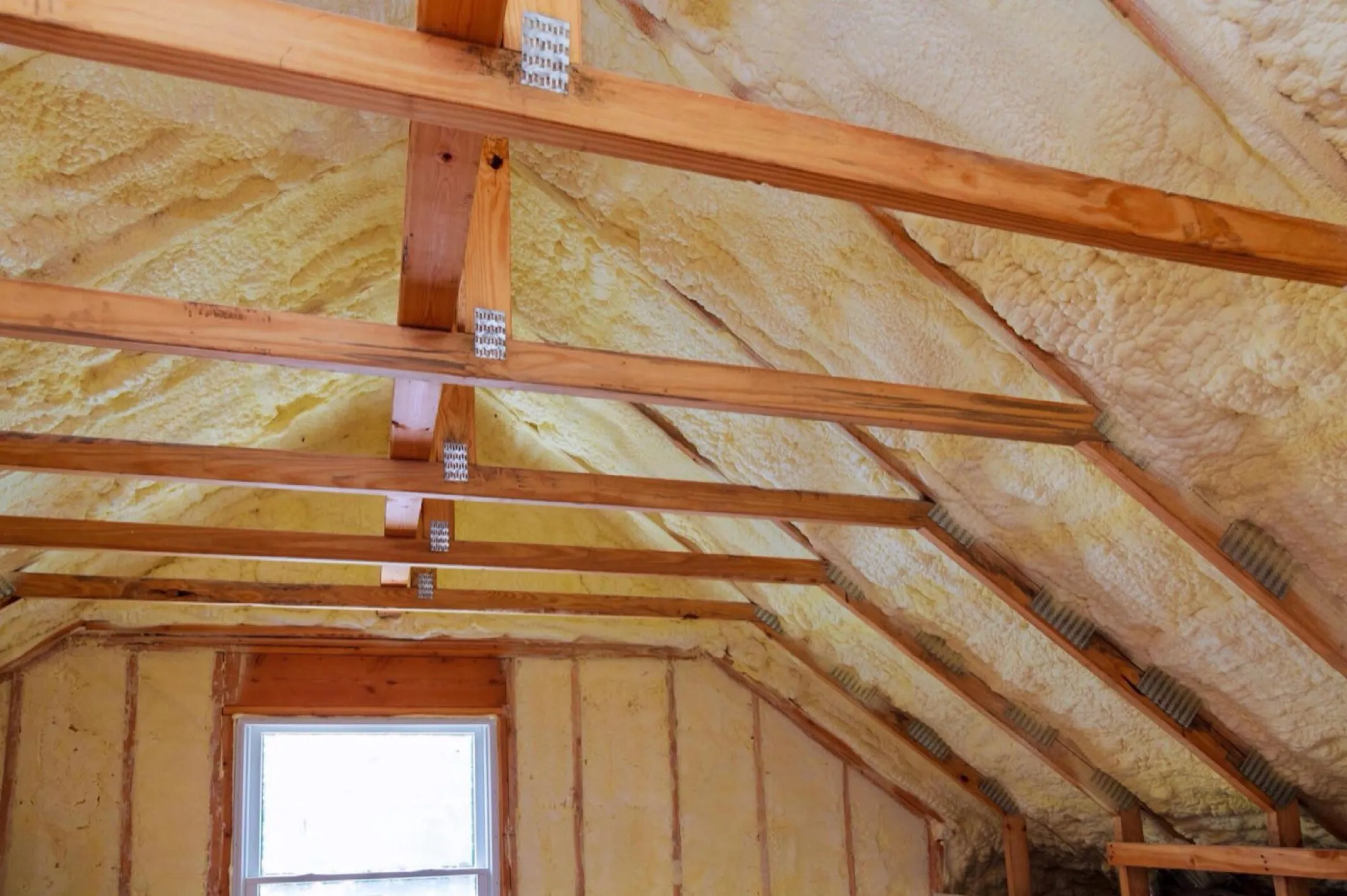 Attic rafters and joists finished with insulation