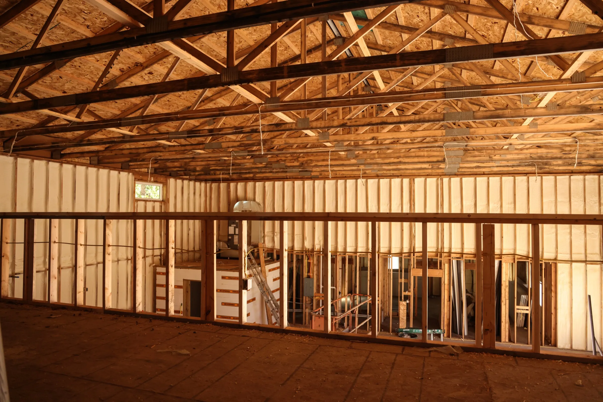 Pole barn interior with a framed mezzanine level